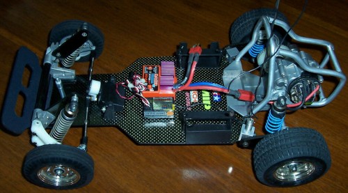 Naked photo, note the mini receiver, mini servo, Novak Hammer and cut down gearbox.