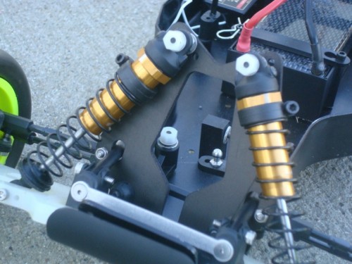 Swapped out the front tower with an earlier piece. This one does not allow the shocks to lean in at the top so much. Keeps the shock perpendicular to the arm under full compression.
