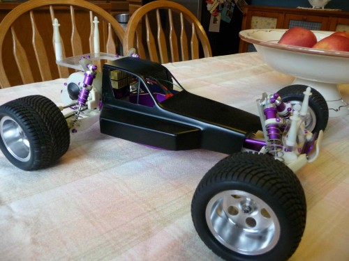 With an old hacked up, blacked out Protech body. :)