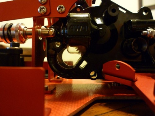 this is the end result of the rear gearbox modification, now the gear mesh can be seen, rather than using the tamiya motor spacers. The clear piece was bonded onto the gearbox using 5min clear epoxy. I did the same for minimini's hotshot too :)