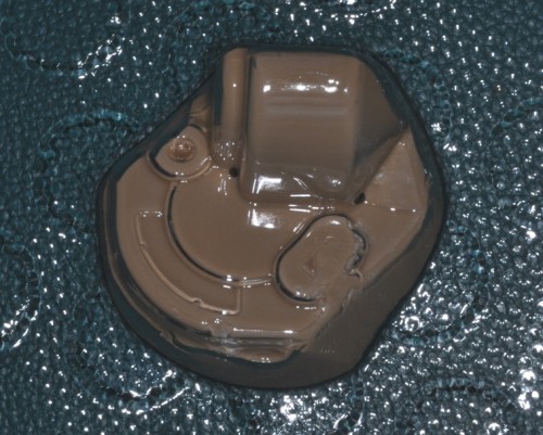 I made a plaster duplicate of the rear gearbox left half using RTV silicone. Then vacumm-formed the clear plastic piece.