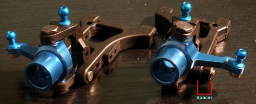 Plastic control arm spacer