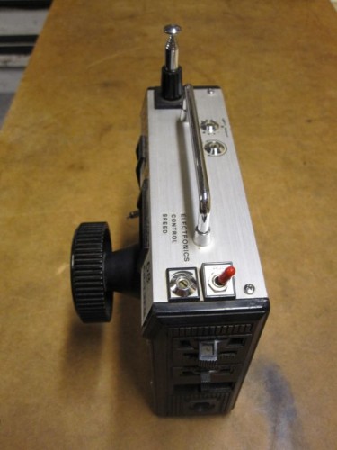 Throttle, throttle trim (center adjustment and fine trim), and 3rd channel lever.  The red switch cuts steering servo travel by an adjustable amount.