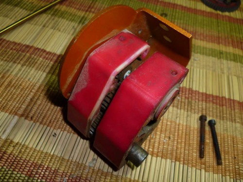 Now you can split the tranny case. I noticed something right away while doing this. There is a lot of rust inside and outside the transmission. It becomes apparent that a previous owner. The same one that dyed the nylon parts pink. Dyed the transmission without taking it apart. They just submerged the whole tranny in Rit dye (notice the white areas of the case that the dye never got to). The water got in and fried this thing we will see what happens.