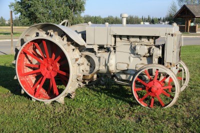 7626395-vintage-tractor-at-historic-farm.jpg