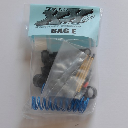 Bag E: Shocks with nitrided shafts, blue springs, even though the rears are 'pink' and more blue nuts!